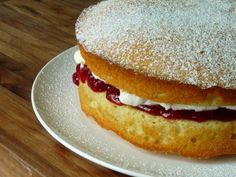 A classic English dessert, Victoria sponge cake. The cake is made up of a vanilla sponge and vanilla icing and strawberry jam